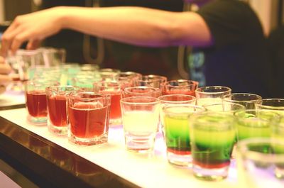 Close-up of drinks on bar counter at nightclub