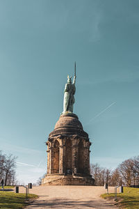 Low angle view of statue against sky