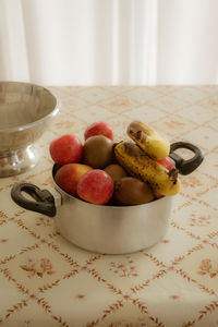 High angle view of fruits in bowl on table at home