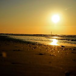 Scenic view of sea against sky at sunset