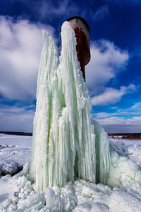 Scenic view of sea during winter against sky