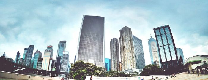 City skyline against cloudy sky