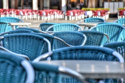 Close-up of empty chairs on table