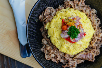 High angle view of fried rice for breakfast served on table