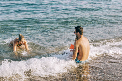 Happy family enjoying at seashore