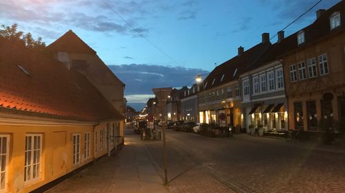 Houses in town against sky