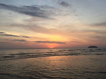 Scenic view of sea against sky at sunset