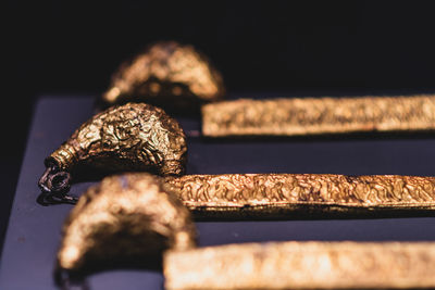 Close-up of food on table against black background