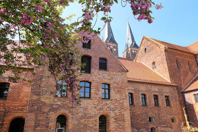 Low angle view of historical monastery in jerichow germany. brick stone building against sky