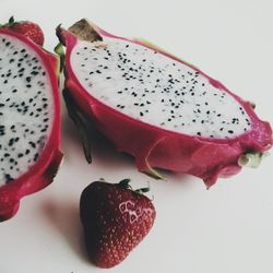 Close-up of strawberry over white background