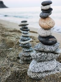Stack of stones on beach. stone balancing for relaxing. sun, sand, stone and sea. 