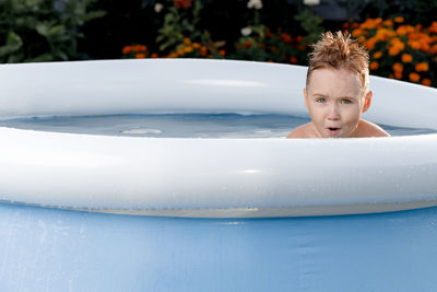 Portrait of young woman in swimming pool