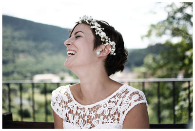 Portrait of a smiling young woman looking away