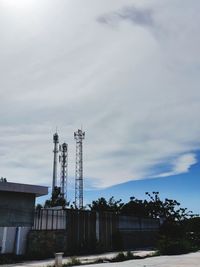 Low angle view of electricity pylon against sky