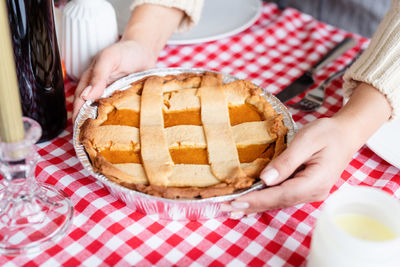 Midsection of woman holding food