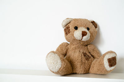 Close-up of teddy bear against white background