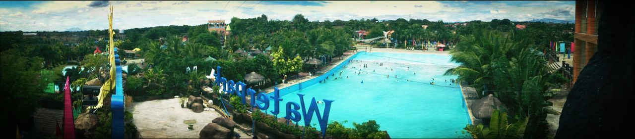 water, tree, panoramic, palm tree, sky, blue, high angle view, nature, auto post production filter, sea, large group of people, growth, beauty in nature, built structure, transportation, fish-eye lens, incidental people, day, green color, beach