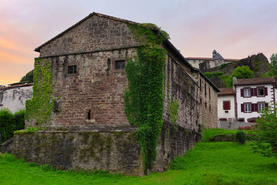 Exterior of old house on building against sky