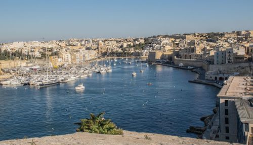 High angle view of buildings by sea