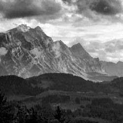 Scenic view of landscape and mountains against sky