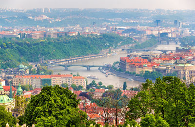 High angle view of river amidst buildings in city