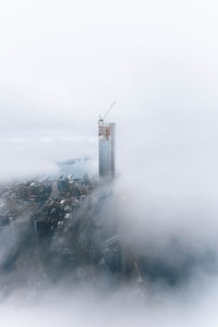 Building in foggy weather against sky