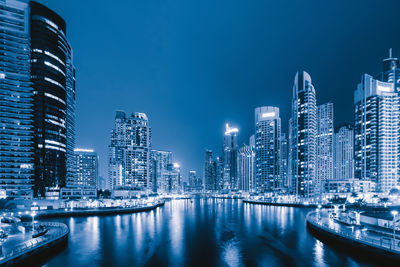 Modern buildings in city at night