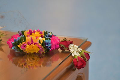 Close-up of multi colored flowers on table