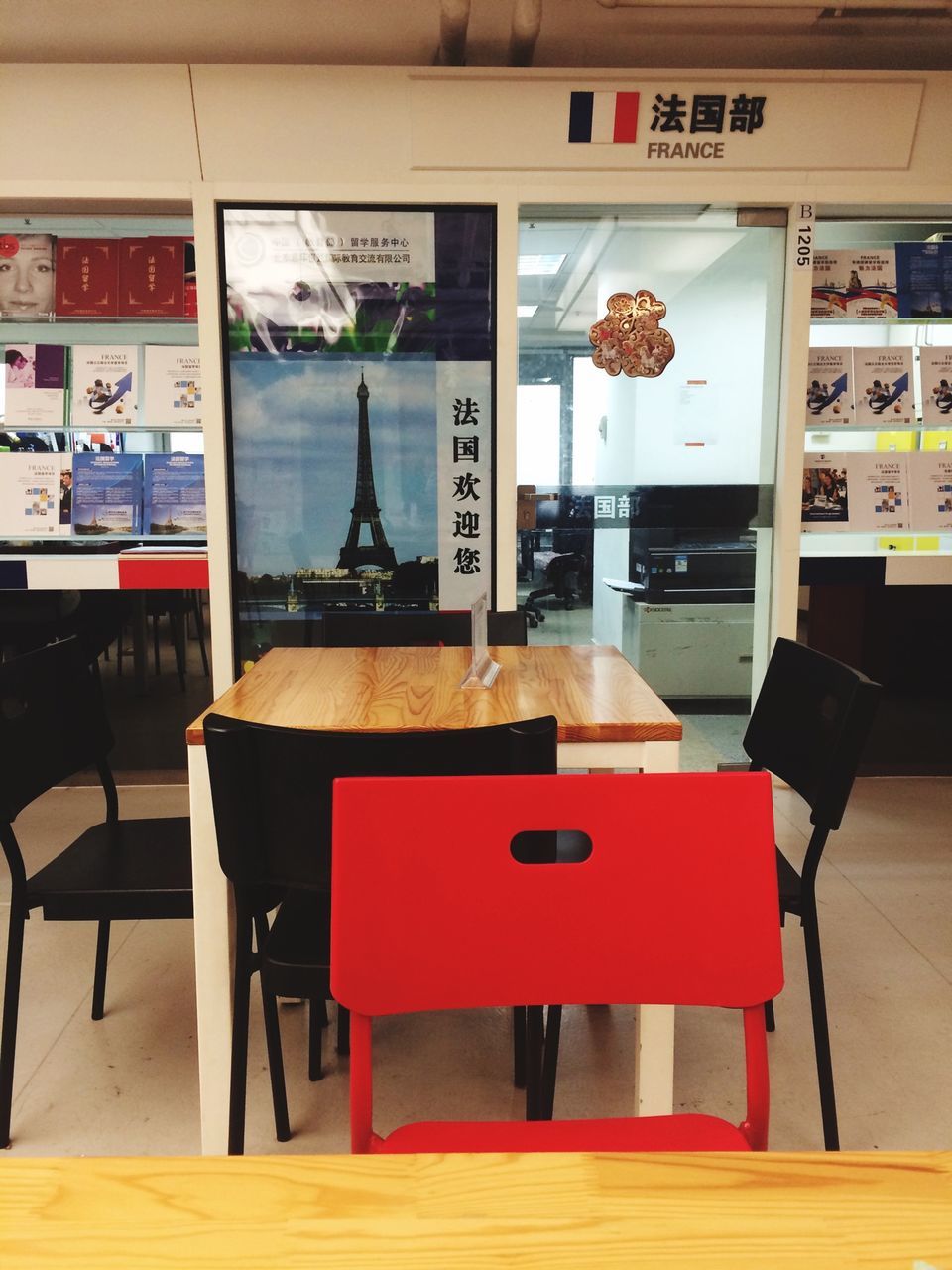 indoors, table, chair, communication, text, absence, restaurant, empty, western script, seat, no people, cafe, incidental people, built structure, architecture, non-western script, window, day, shelf, store