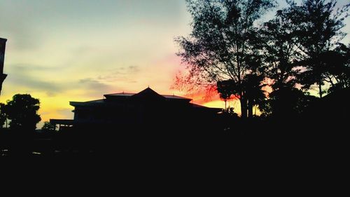 Built structure against sky at sunset