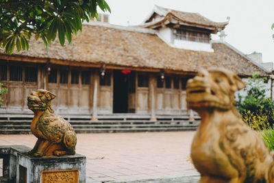 Statue in front of building