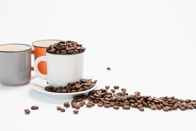 View of coffee beans against white background