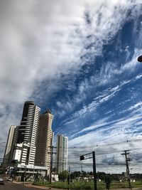 Skyscrapers in city against sky