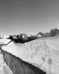 Scenic view of snowcapped mountains against clear sky