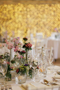 Flower vase and empty glass on dinning table