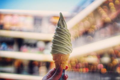 Cropped hand holding ice cream