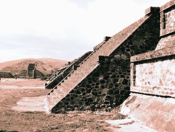 View of old building against cloudy sky