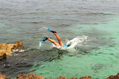 Man swimming in sea