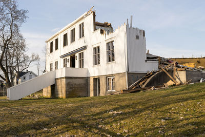 Demolished buildings in city against sky