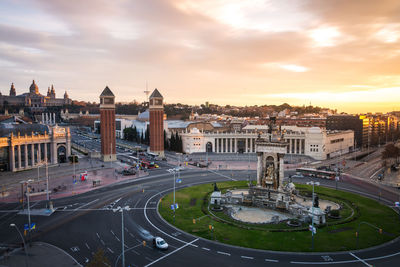 High angle view of city street against cloudy sky
