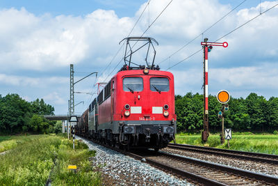 Train on railroad track against sky