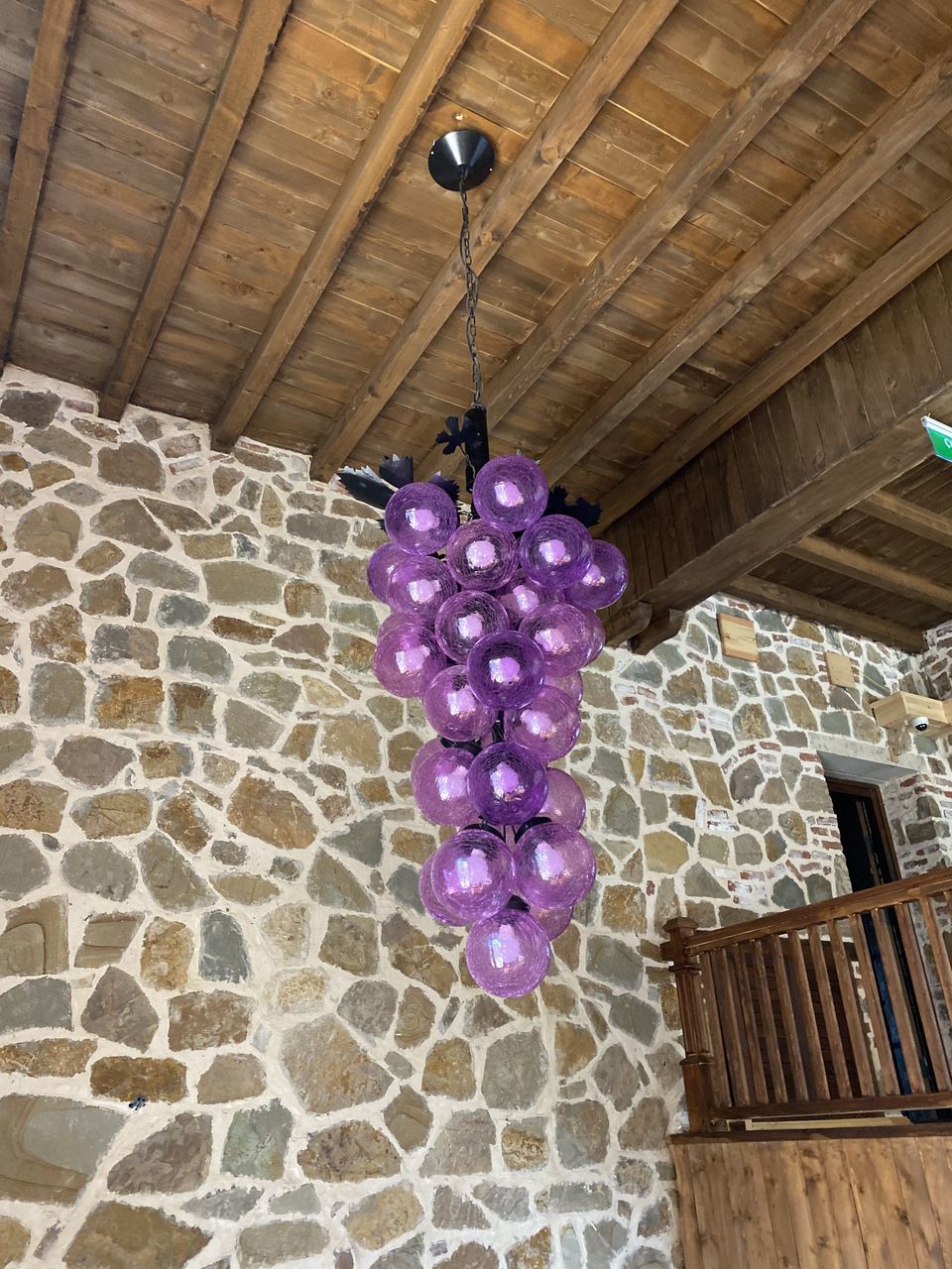 LOW ANGLE VIEW OF ILLUMINATED CHANDELIER HANGING ON CEILING