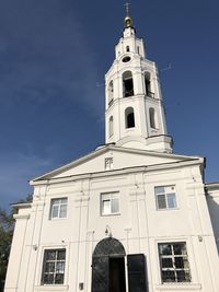 Low angle view of building against blue sky