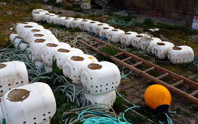 High angle view of pots stack on field