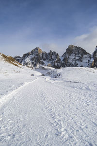 Scenic view of snowcapped mountains against sky