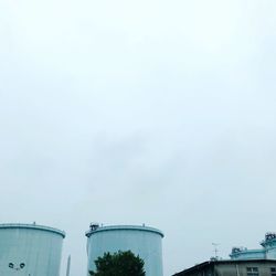 Low angle view of factory against sky