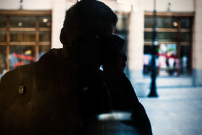 Man taking selfie in mirror reflection