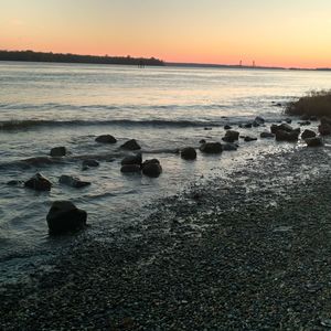 Scenic view of sea against sky during sunset