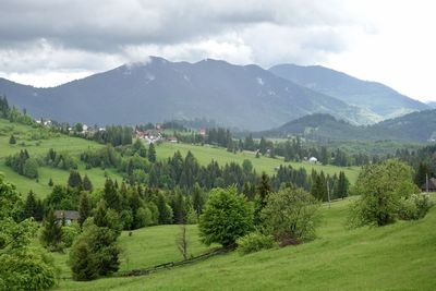 Scenic view of landscape and mountains against sky