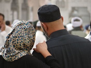 Rear view of couple in street